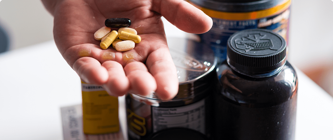 close-up-of-bodybuilding-pills-in-hand-of-a-man-2024-10-17-18-00-29-utc-min
